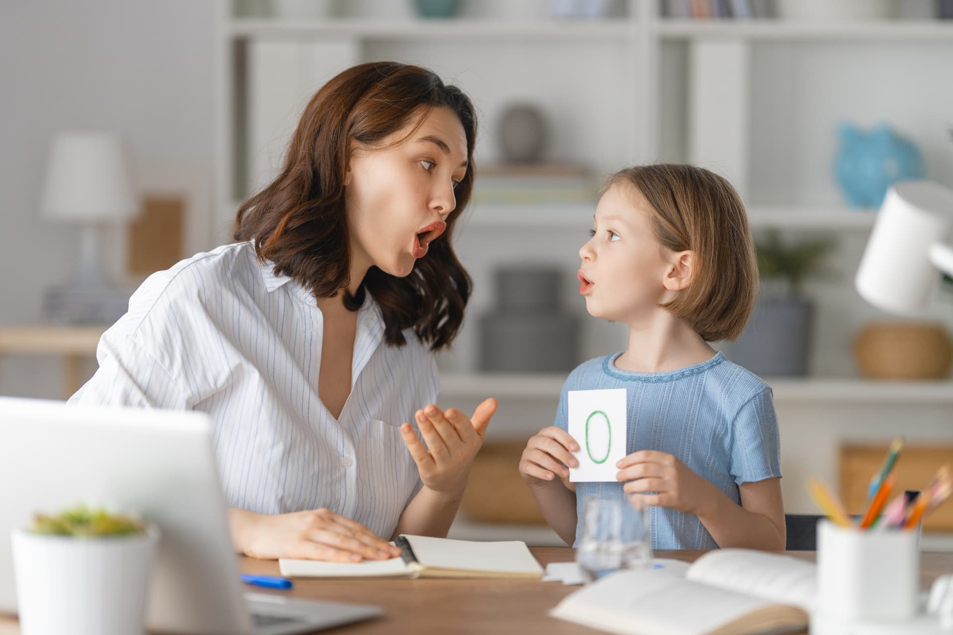 Speech therapist working with a child
